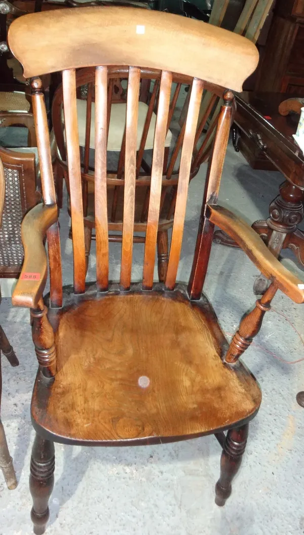 A 19th century stick back scullery open armchair and a wheelback dining chair.