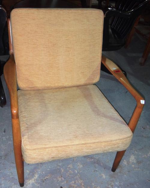 A 20th century Danish beech low armchair and an oak two tier trolley.