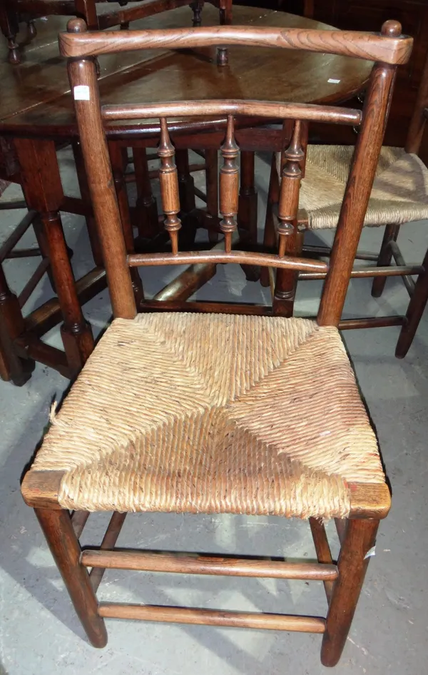 A set of four 19th century Provincial ash and elm rush seated dining chairs.