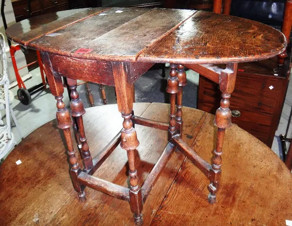 A 19th century oak miniature gate leg table, another similar and a mahogany standard lamp.
