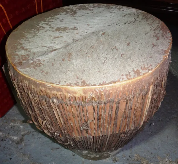 An animal hide drum, together with a German zither.