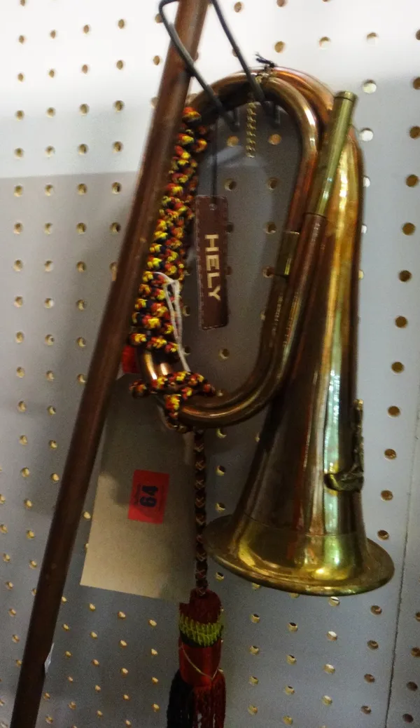 A copper and brass bugle, together with two long hunting horns.