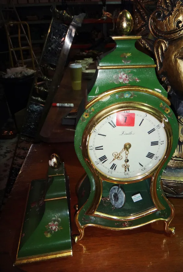 A green and floral painted mantel clock and bracket.