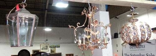 An octagonal brass and glass hanging lantern and two gilt metal and glass ceiling lights.