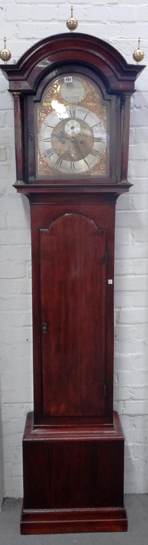 A George III mahogany eight day longcase clock, the arch top twelve inch dial with subsidiary day of month and seconds aperture, silver chapter ring a