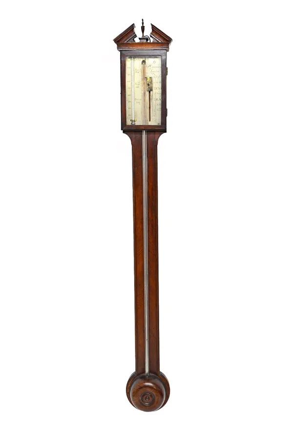 A George III mahogany cased stick barometer by P. Caminuda Taunton, with broken arch pediment and silvered rectangular plate over a chamfered body and