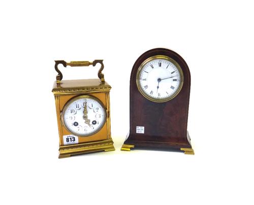 A French gilt brass cased mantel clock, early 20th century, the enamel dial painted with floral swags, on a stepped plinth, enclosing a two train move