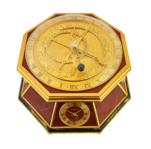 An octagonal gilt and lacquered brass and red marble veneered desk clock compendium, Kutchinsky, 20th century, comprising; an orrery with a quartz mov