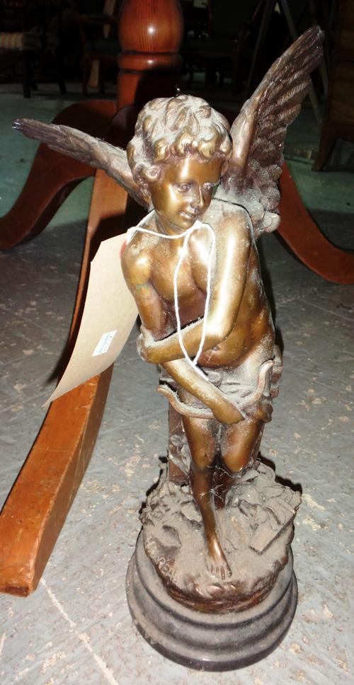 A 20th century bronze figure of a winged angel on a marble base.