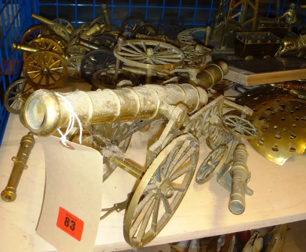 A quantity of 20th century decorative brass ornamental cannons.