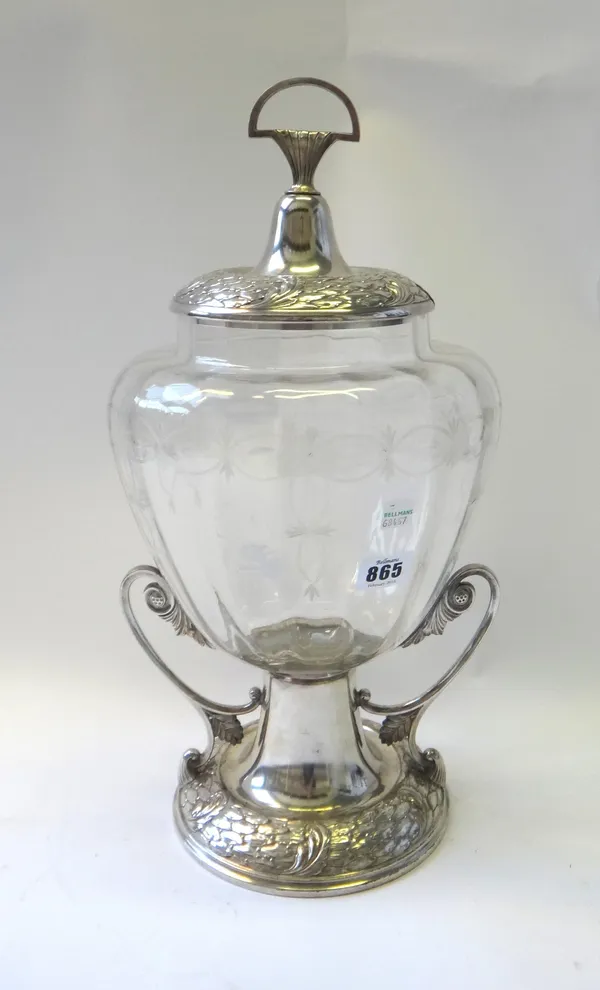 A WMF silvered metal and clear glass punch bowl and cover, early 20th century, the cover and foot cast with overlapping leaves and berries, the glass