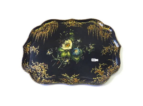 A Jennens and Bettridge papier mache tray, 19th century, centrally decorated with still life flowers within a shaped gilt foliate border, stamped to r