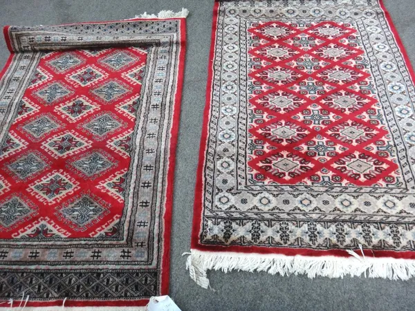Two Indian Bokhara rugs, one 120cm x 78cm, one 119cm x 77cm.