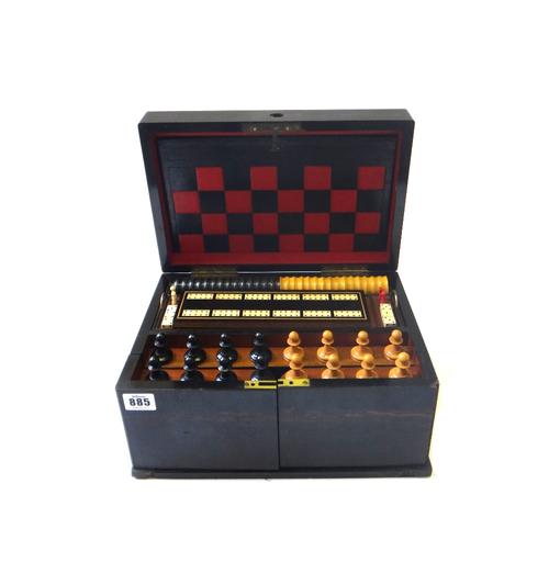 A Victorian coromandel games compendium, the hinged lid and doors opening to reveal a chess set, checkers, and four sets of playing cards (a.f), 32.5c