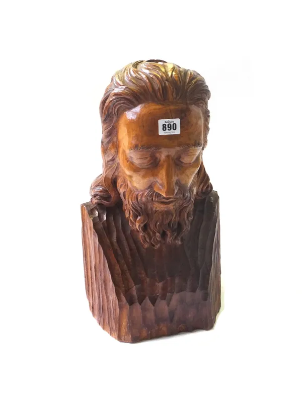 A stained pine carved bust, early 20th century, depicting a bearded man (probably Jesus) in contemplation, 50cm high.