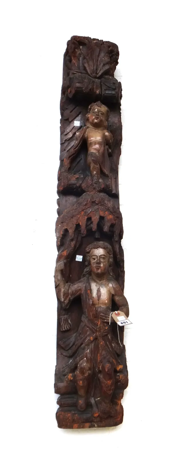 An 18th century polychrome painted carved wooden corbel with shell surmount and canopy flanking two putto figures, 122cm.