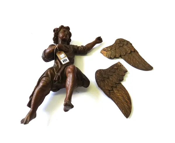 A late 17th century carved wood figure depicting a winged angel in flight, his arm outstretched, wings detached, (a.f.), 50cm high.