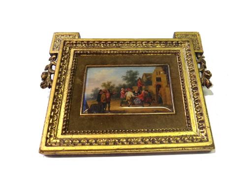 After Jan Steen, a rectangular miniature painting, designed as a merry making scene outside a building, with trees beyond, in the Dutch taste, display
