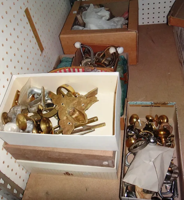 A large quantity of 19th century and later door furniture, including brass knobs, ceramics plates and sundry.