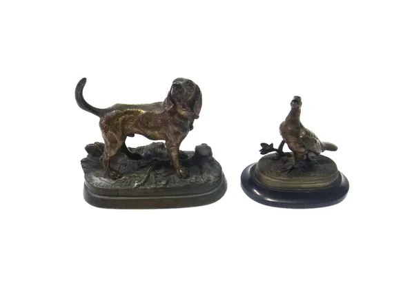 After Dubucand; a bronze of a hound, late 19th century, set atop a naturalistic base, 10.5cm high, together with a patinated bronze pheasant signed 'M
