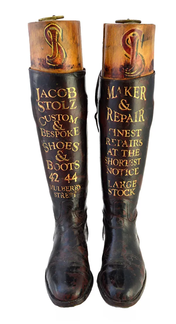 A pair of leather riding boots with wooden trees, early 20th century, each gilt lettered 'Jacob Stolz custom and bespoke shoes and boots, 42 44 Mulber
