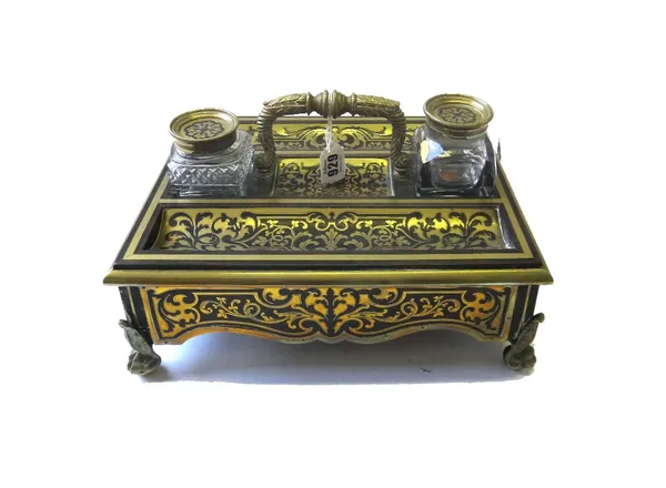 A Victorian brass inlaid tortoiseshell desk set, to include a blotter, a picture frame, a circular box and pen tray, and a brass inlaid ink stand, 31c