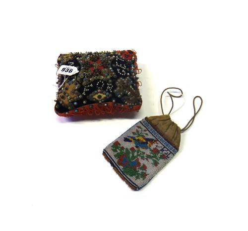 A sailor's Valentine pin cushion, late 19th/early 20th century, detailed 'Forget me not Nelly', 16cm wide, and a beadwork drawstring purse. (2)