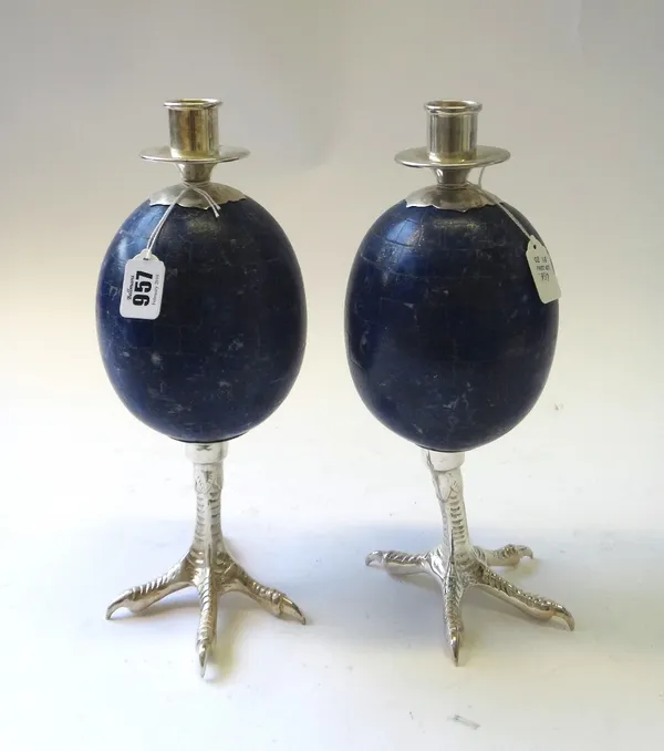 A pair of Anthony Redmile lapis lazuli and nickel plated candlesticks, late 20th century, the sconce surmount over an ostrich egg shaped body on a sim