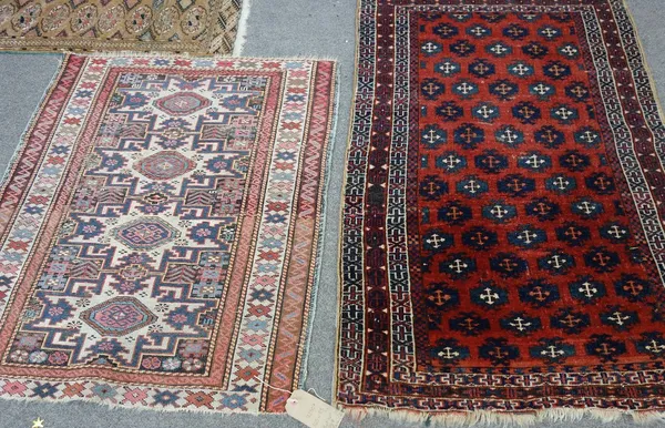 A Beshir rug, the madder field with diagonal rows of minor medallions, a cross border, 132cm x 82cm, together with a Lesghistan rug, the indigo field