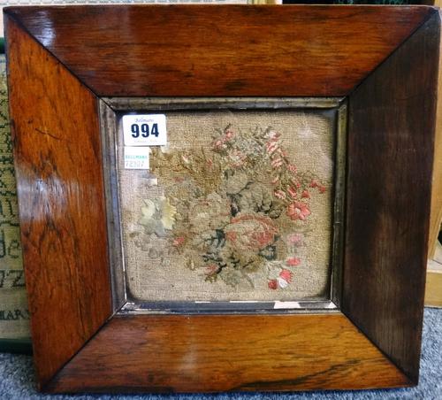 A Victorian embroidered foliate panel in a wide square rosewood frame, 16cm x 14cm, together with two alphabet samplers, both 19th century, framed and