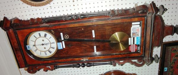 A 19th century walnut and ebonised eight day wall clock.