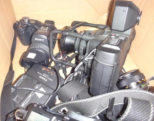 A quantity of 20th century cameras, including Fuji, Canon, Sony and others.