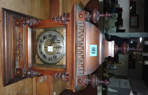 A 19th century walnut cased eight day mantel clock, together with a Black Forest cuckoo clock.