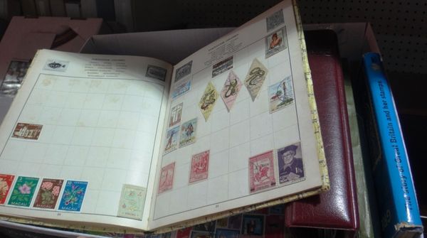 A quantity of postage stamps and stamp albums.