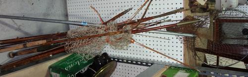 A quantity of early 20th century split cane and bamboo fishing rods.