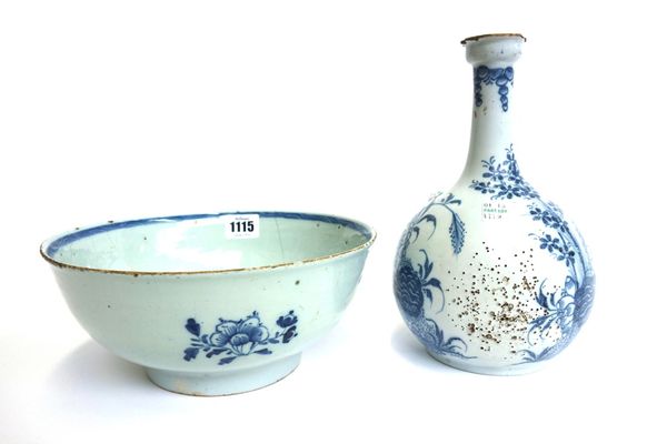 An English delftware blue and white bowl, mid 18th century, painted with foliate sprays, 22.5cm diameter, together with a blue and white delftware gug