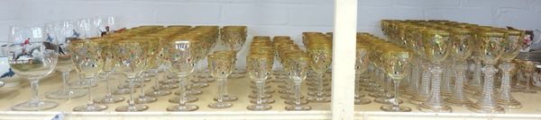 A part suite of Continental glasses, 20th century, each with gilt foliate and coloured jewelled decoration, together with five large 20th century wine