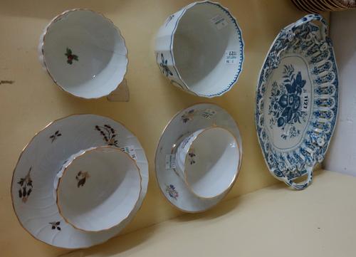 A Worcester blue and white fluted bowl, late 18th century, painted with sprays of flowers, 10cm diameter, a Worcester blue and white printed two handl
