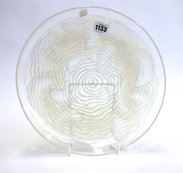 A Lalique 'Dauphins' opalescent circular glass shallow dish, circa 1932, with stencil etched mark to the centre 'R. Lalique, France', 29.5cm diameter.
