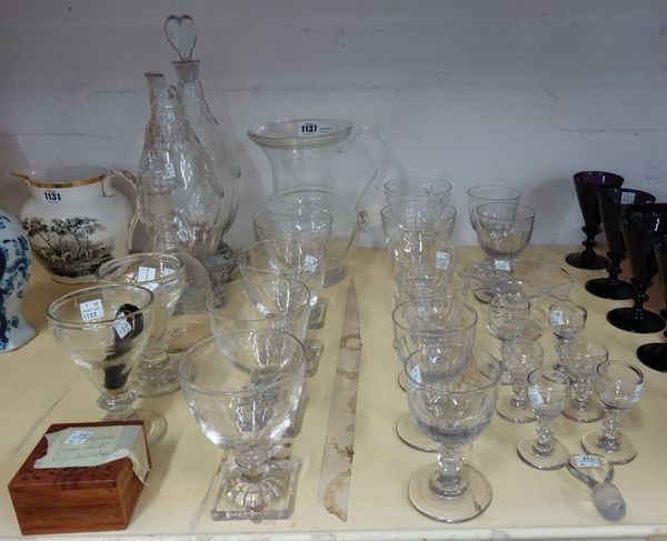 A quantity of Georgian and later glass etched goblets on square feet, a pair of decanters with heart shaped stoppers, a three ring etched glass decant