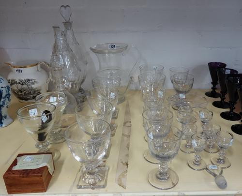 A quantity of Georgian and later glass etched goblets on square feet, a pair of decanters with heart shaped stoppers, a three ring etched glass decant