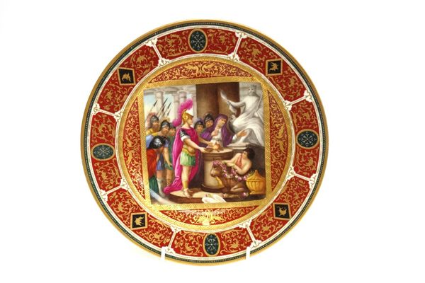 A Vienna style cabinet plate, late 19th century, painted with Roman soldiers before a statue of Jupiter, within a gilt foliate multicoloured wide bord