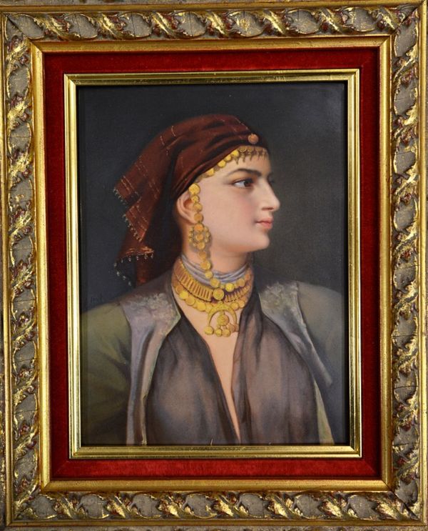 A Vienna portrait plaque dated 1862, painted with a half length portrait of an Eastern lady in profile wearing elaborate gold jewellery, signed 'M. St