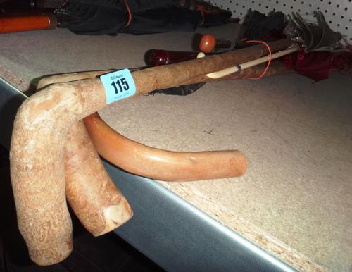 A quantity of assorted walking sticks and parasols.