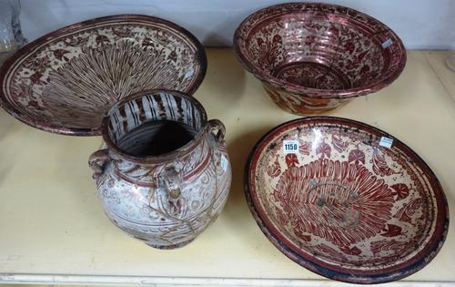 A group of Hispano Moresque lustre wares, 17th century, comprising; a deep bowl, a large shallow bowl and a smaller shallow bowl, each painted with st