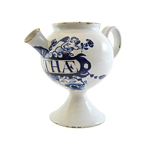A delftware blue and white syrup jar, mid 18th century, detailed 'S. Althae' within a cherub and foliate border, on a tapering circular foot, 16cm hig