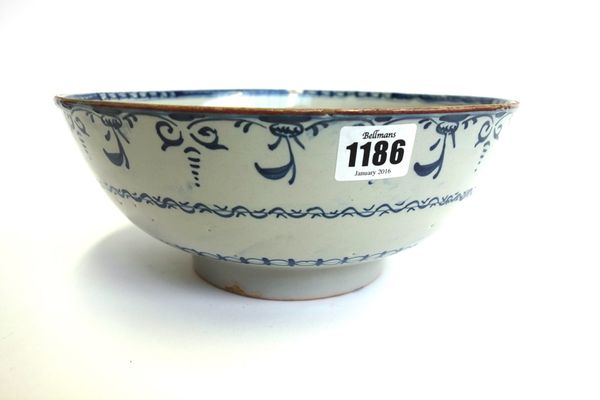 An English blue and white delftware bowl, circa 1760, decorated with stylised foliate bands, 25.5cm diameter.