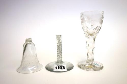 A engraved Continental wine glass, late 18th/19th century, the bell bowl engraved with flowers, raised on a double series opaque twist stem and plain