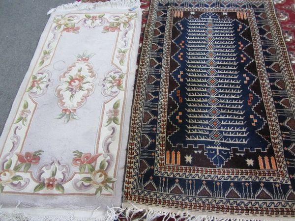 A Chinese rug and a Beluche rug (2).