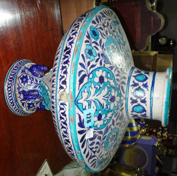 A late 19th century Indian ceramic turquoise decorated vase on stand.